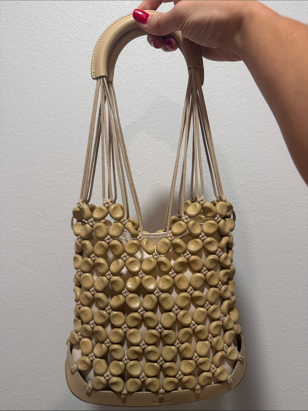 Polène Solé. Beige Woven Bead Bucket Bag